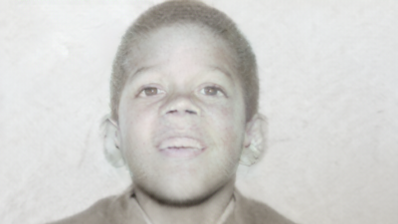 A young Al Berry, seated for a childhood portrait